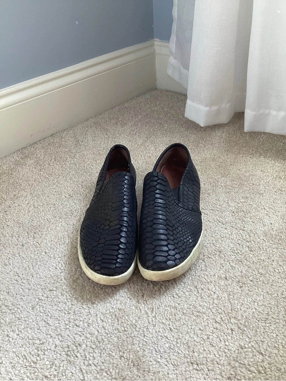 Joie Kidmore Slip-On Sneaker in a black snake-embossed leather